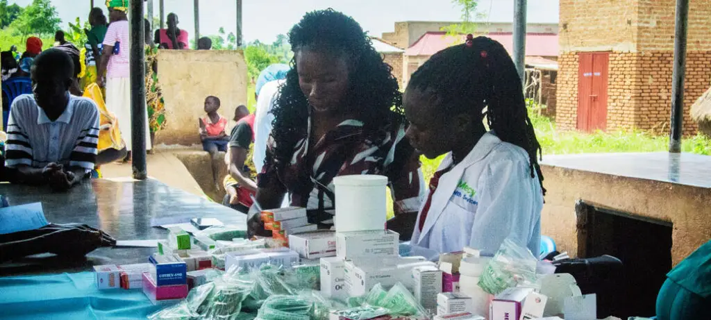 Women handing out medical supplies