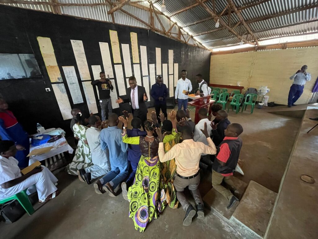 People worshipping at alter