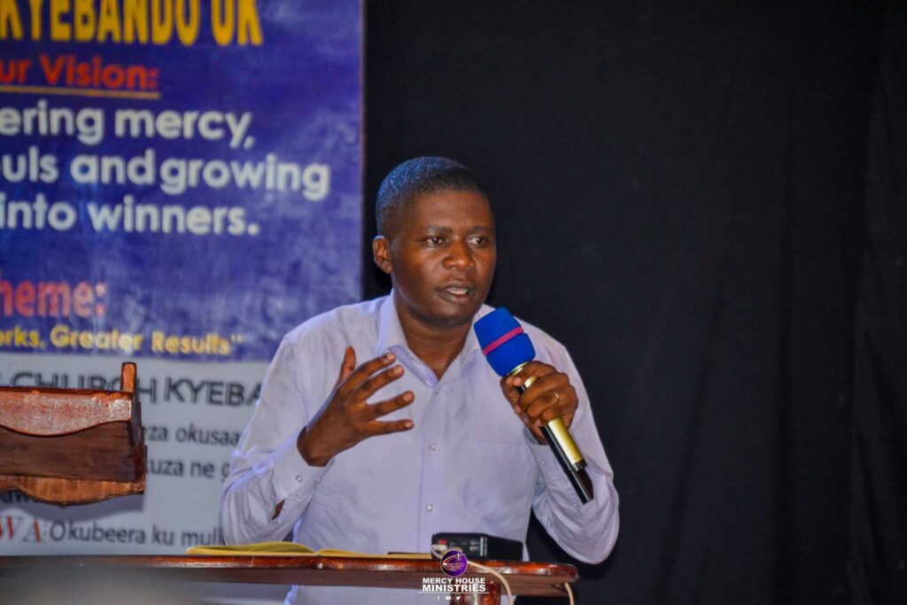 Dr Gilbert Speaking with Microphone